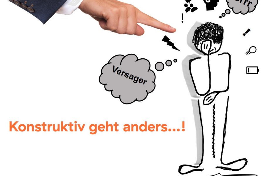 Ausgestreckter Zeigefinger auf Karikatur, die Hand vor gesenkten Kopf hält